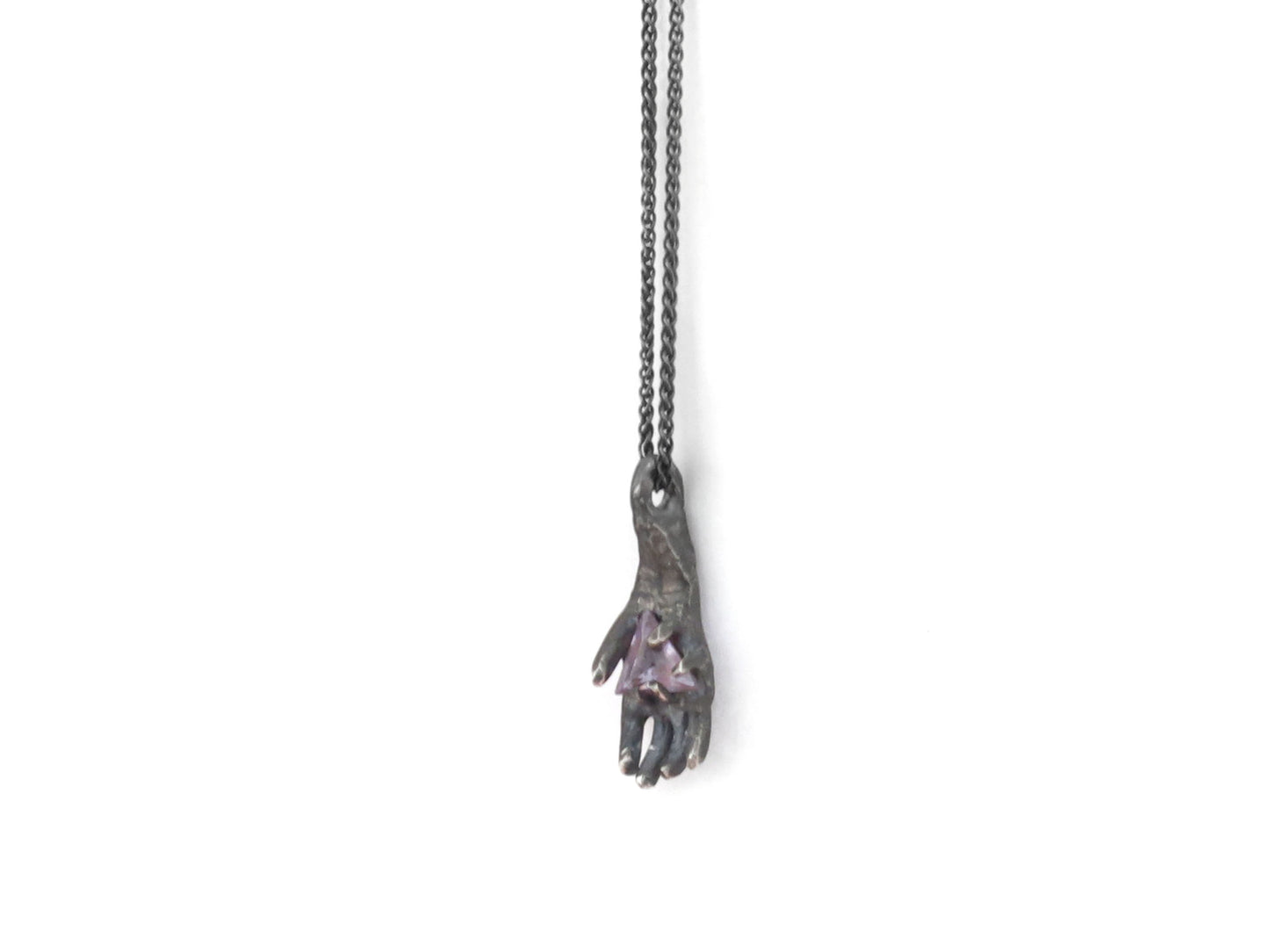HAND HOLDING TRIANGLE AMETHYST