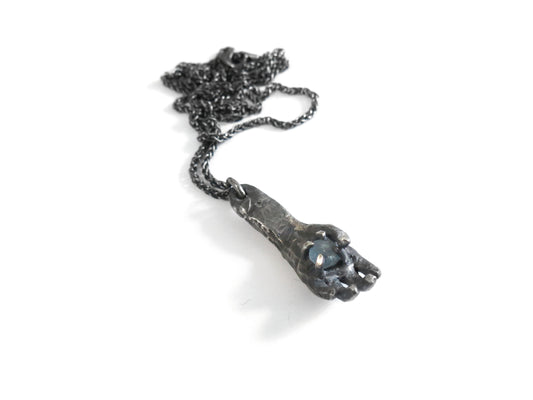 HAND HOLDING ROUGH MONTANA SAPPHIRE