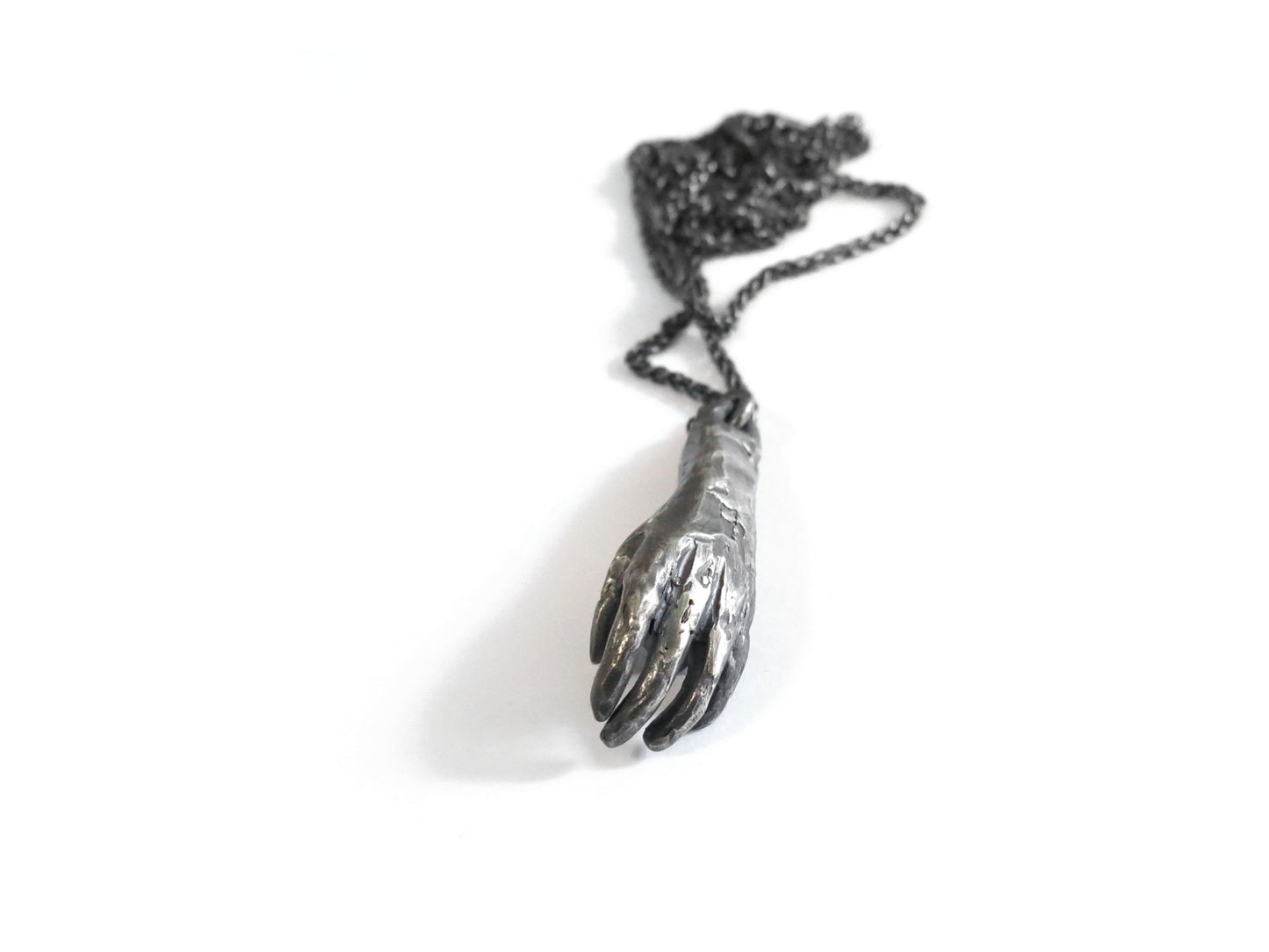 HAND HOLDING ROUGH MONTANA SAPPHIRE