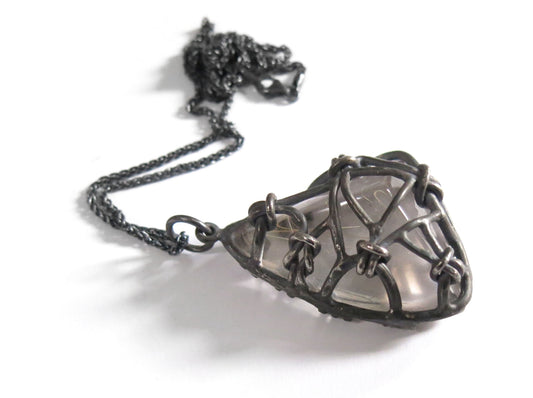 WEIRD TRIANGLE RUTILE QUARTZ KNOTS