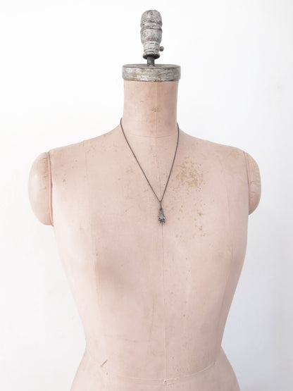 HAND HOLDING ROUGH SAPPHIRE